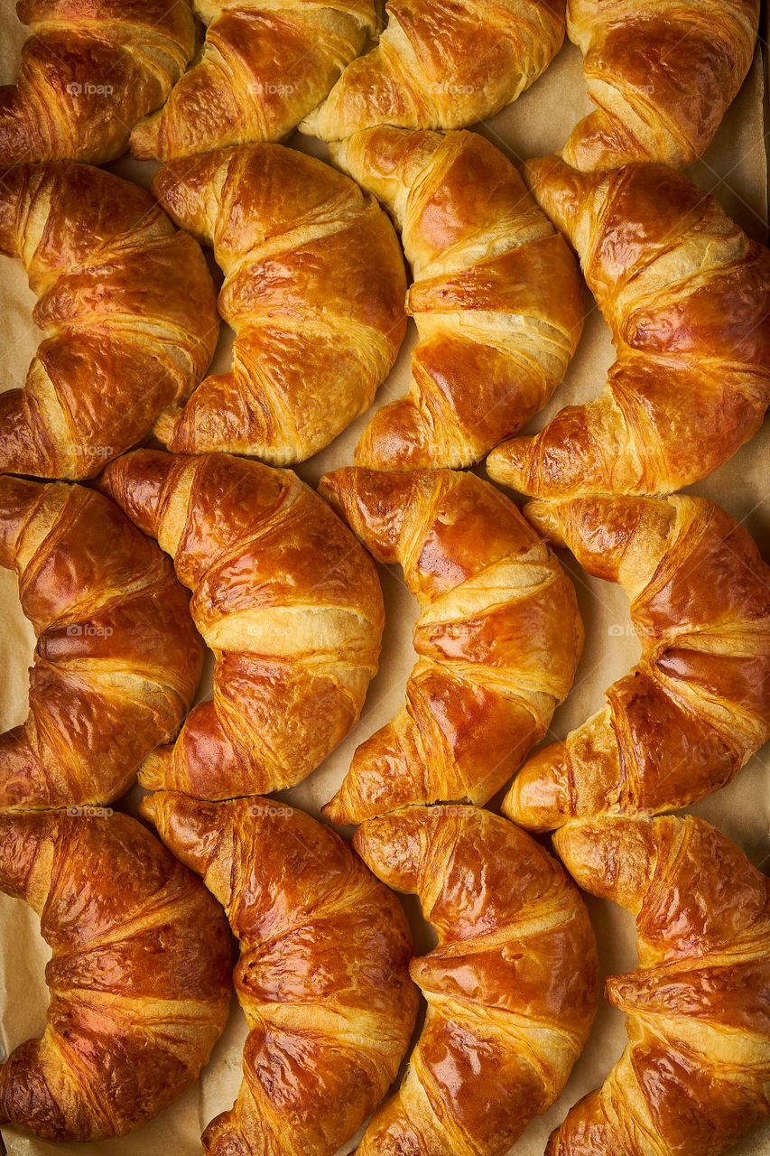 Croissants baking, top view