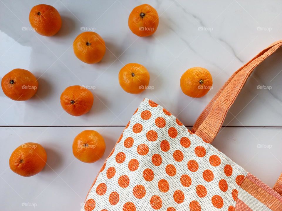 round tangerines with a bag.