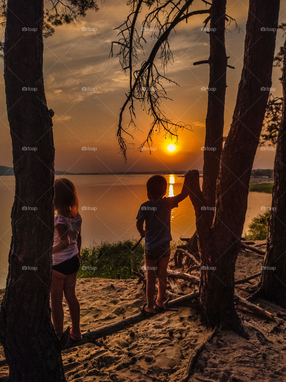 watching the sunset on the river