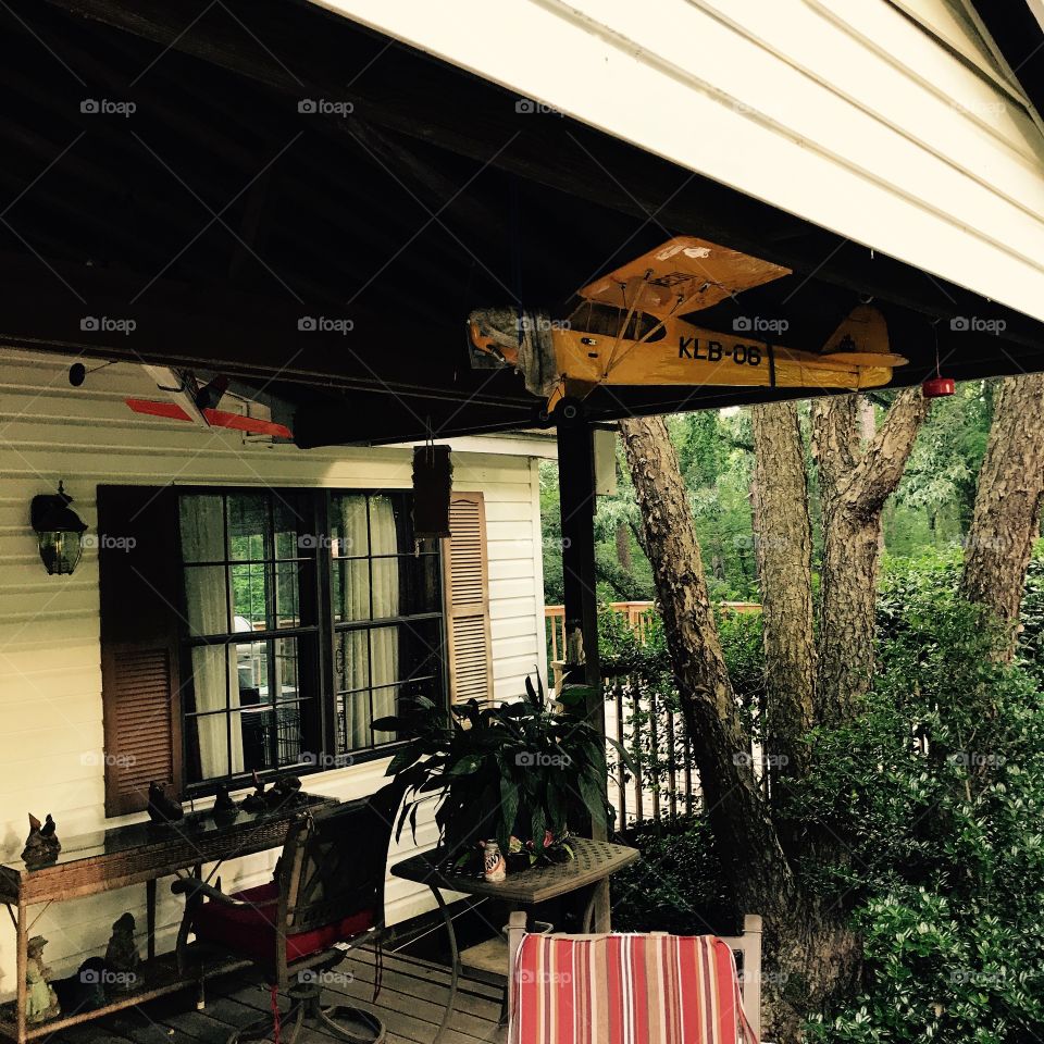 My grandmother's porch with one of my grandfather's model airplanes.