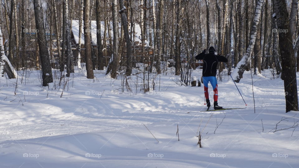 Man skiing on snowy land