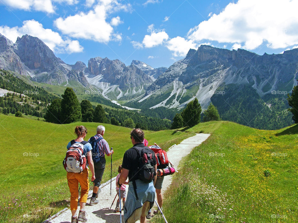 hike family in summer dolomiten mountain Italy