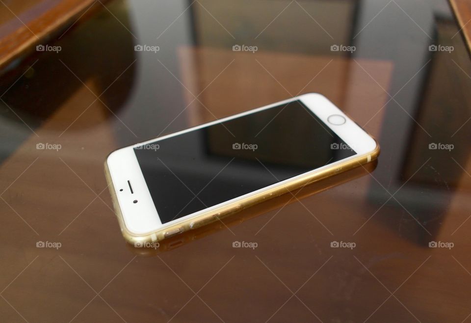 iPhone 6 on a glass table 