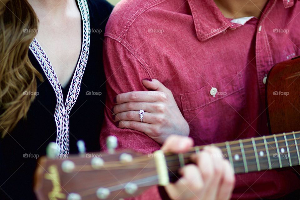 Engagement ring and a guitar