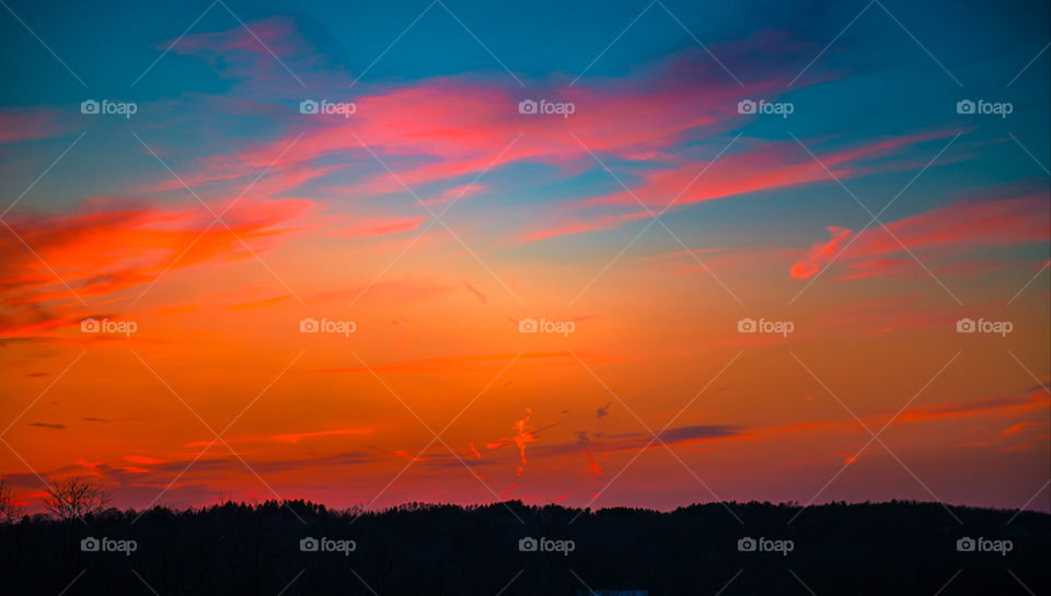 Cross, clouds, sunset