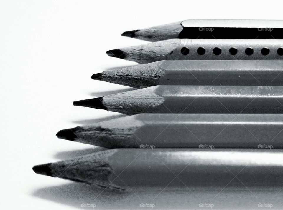 Pencils arranged in a row