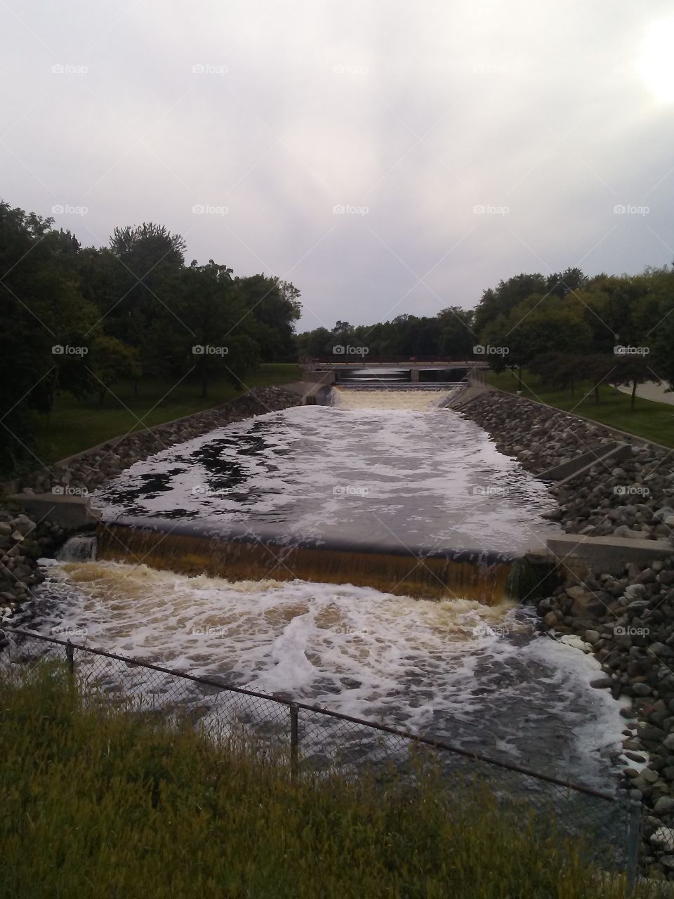 Manitowoc River rushing through the dam and falls in Chilton, Wisconsin.