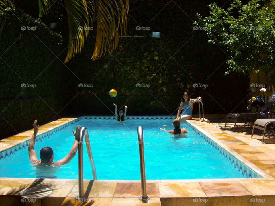 Friends having fun in the pool