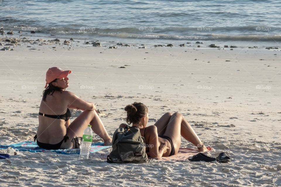 Beautiful women sunbath on the beach