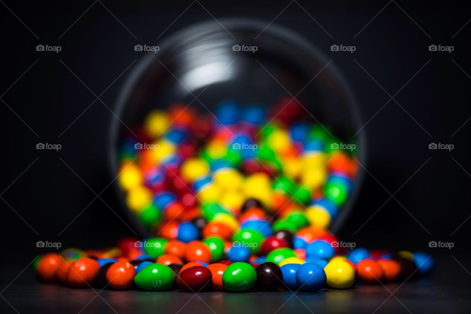 M and M candy against black background