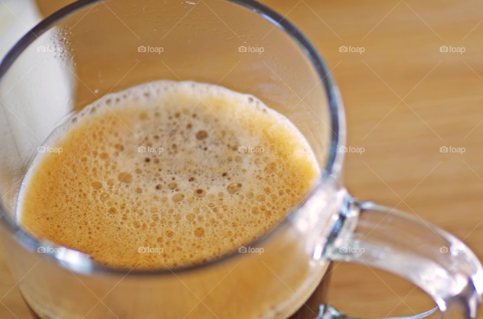 High angle view of tea on transparent cup