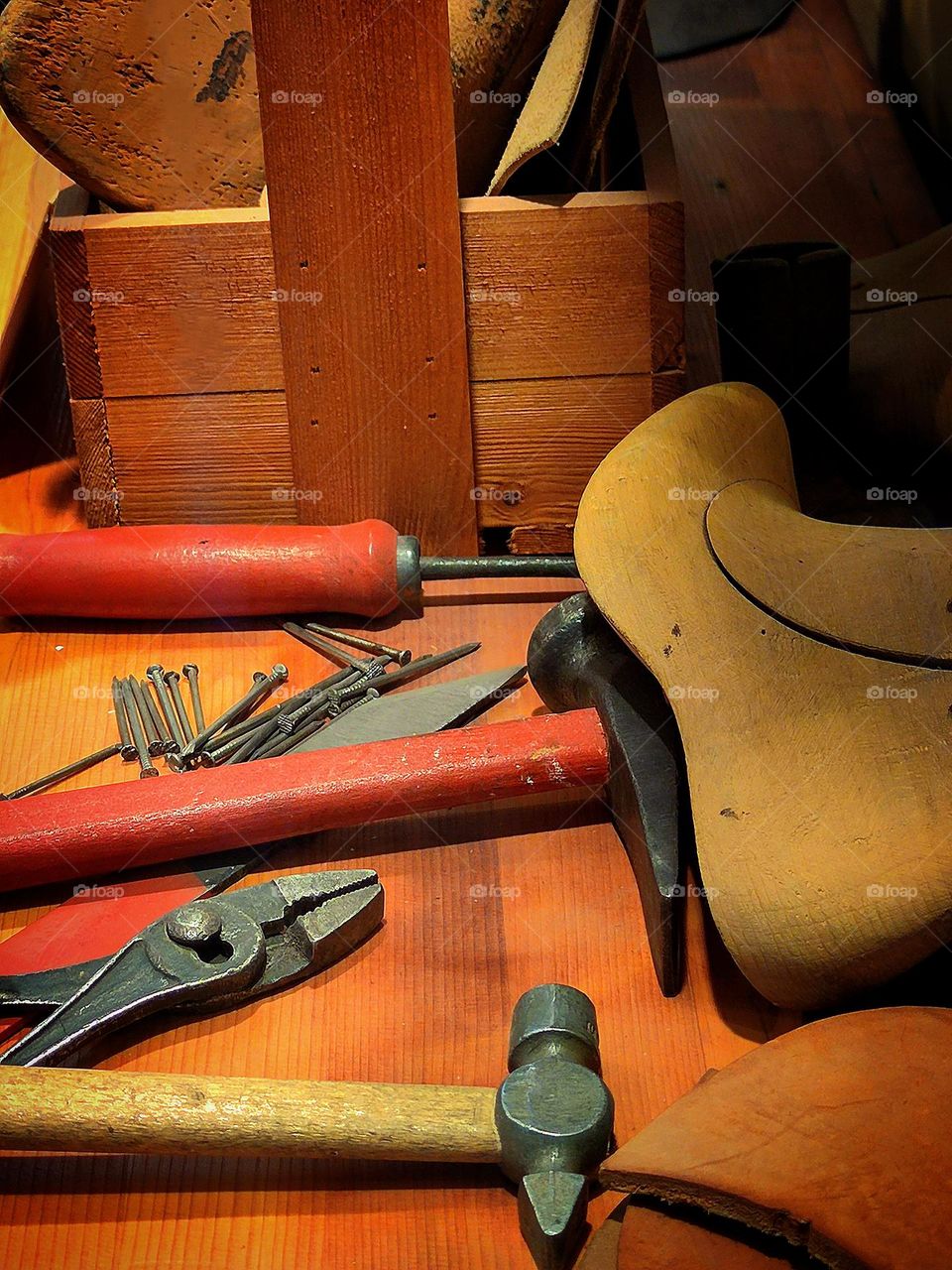 Autumn. Shoe repair. Nails, hammer, pliers, awl, shoemaker's hammer, wooden shoe trees