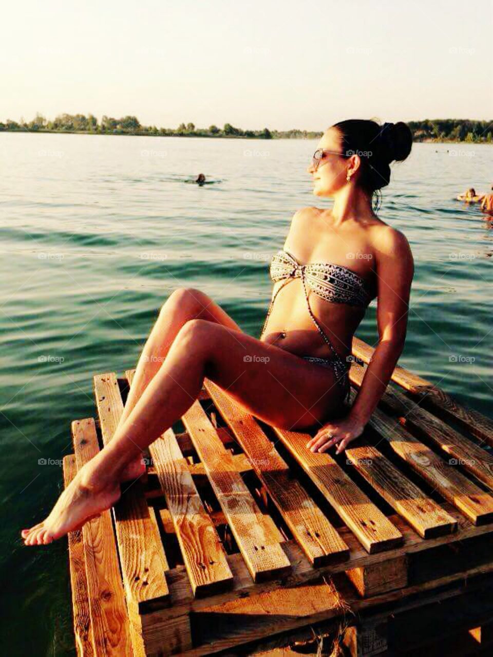 Woman in swimsuit relaxing at beach