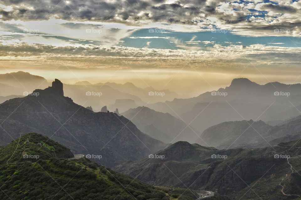 Foggy sunset view over the mountains