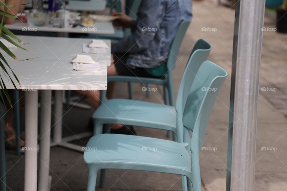 Blue chairs by the table