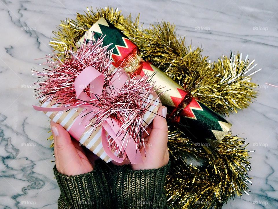 Holiday gift giving, Christmas present, pink and gold sparkles