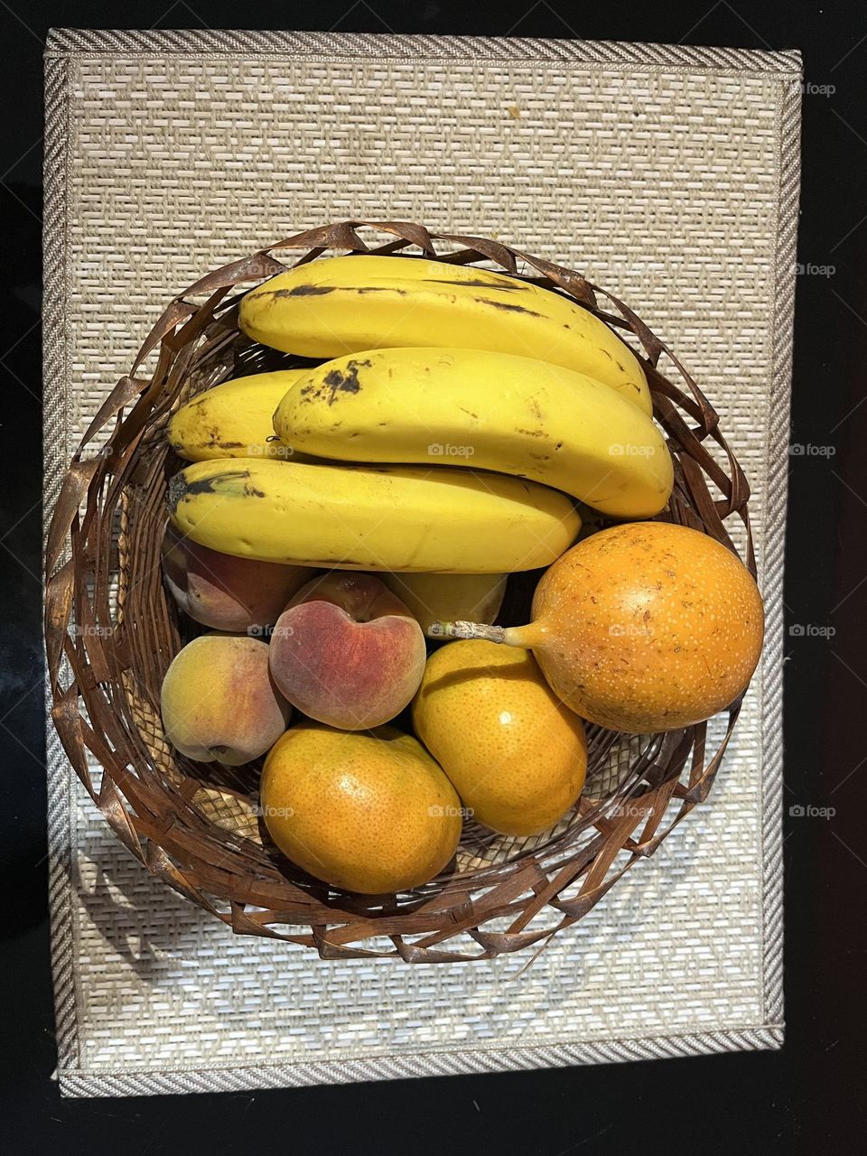 A circle basket with some fruits