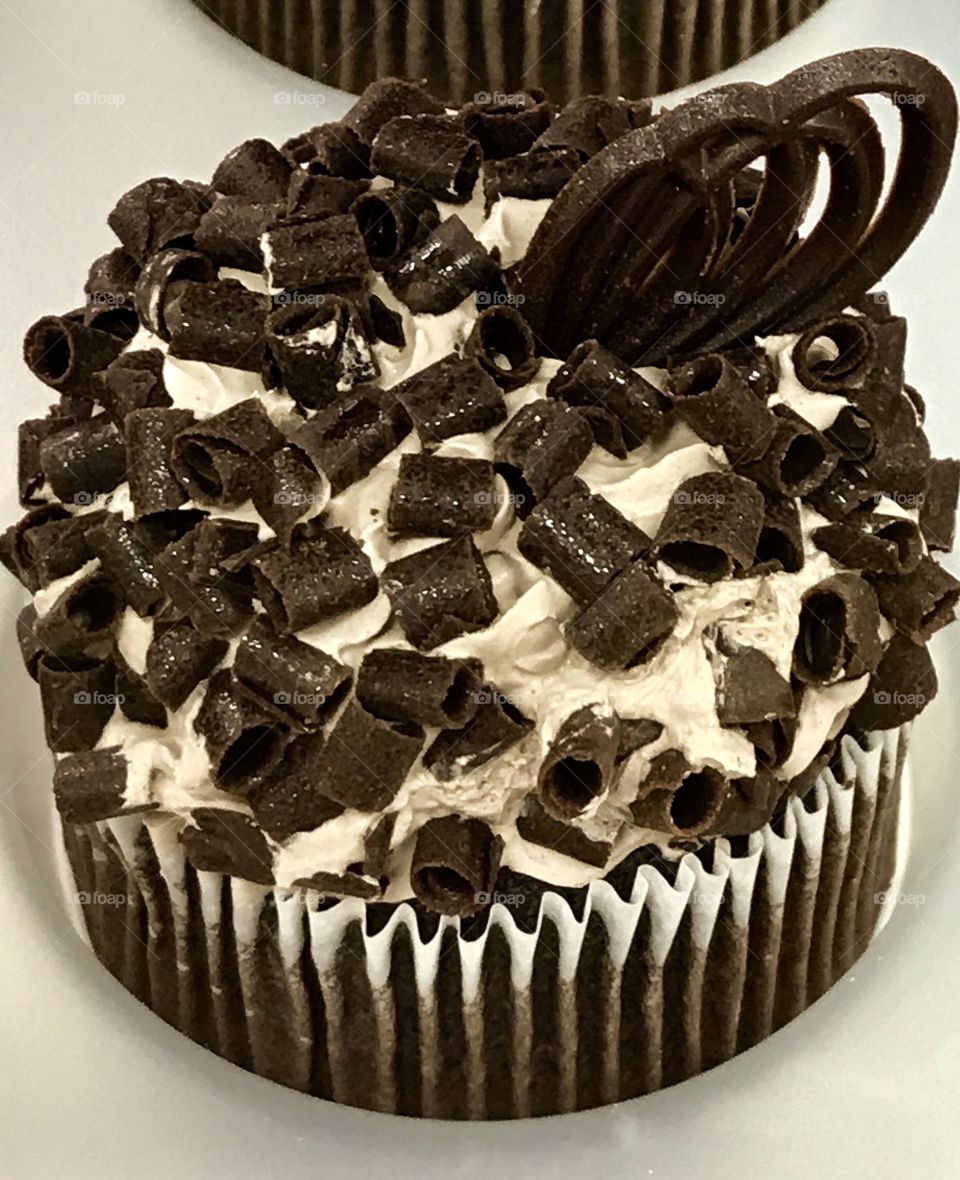 Chocolate shavings on chocolate cupcake 