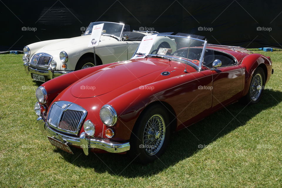 Red And white MGA's . A pair of read and white MGA's 
