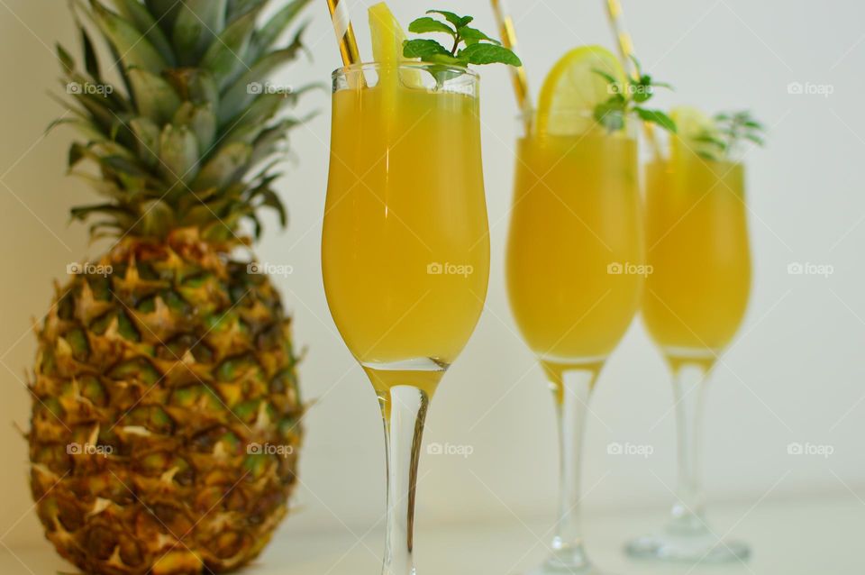 three glasses of pineapple juice