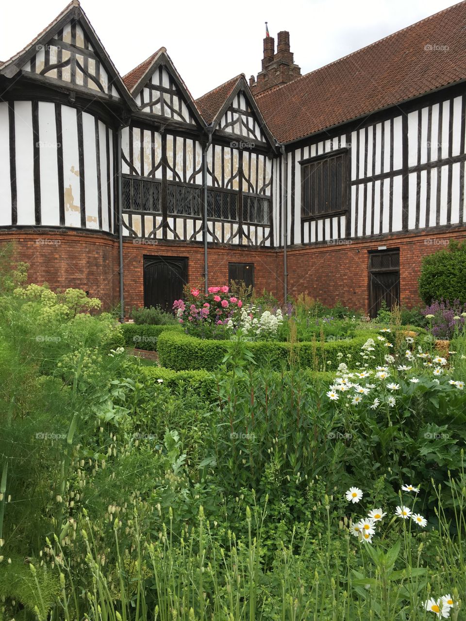 Exterior view of the medieval Manor House and the garden at Gainsborough Old Hall
