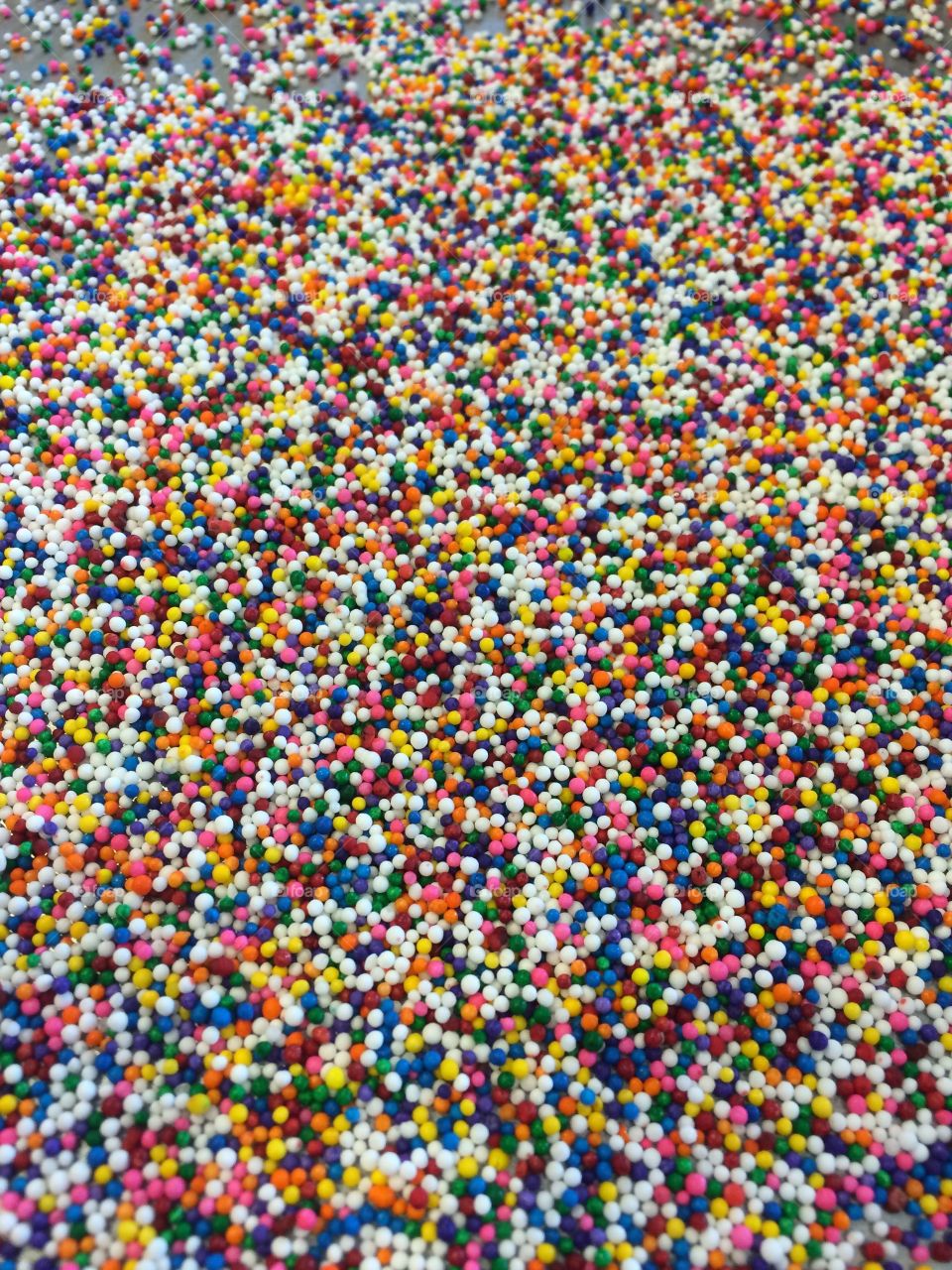Sheet pan of sprinkles for decorating slice and bake cookies