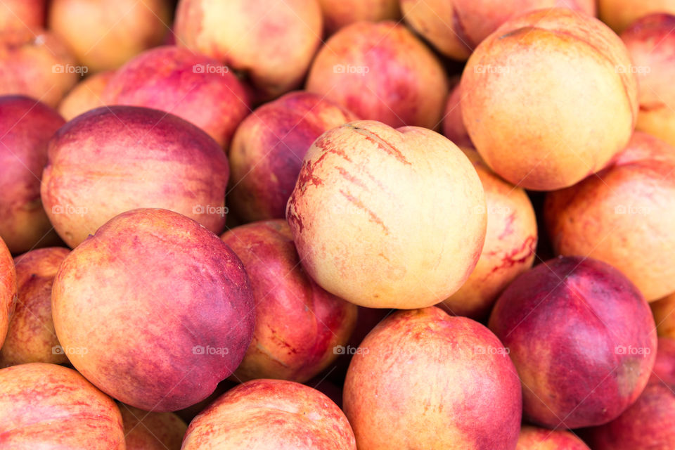 Fresh Nectarines Peaches Fruits In Grocery Supermarket
