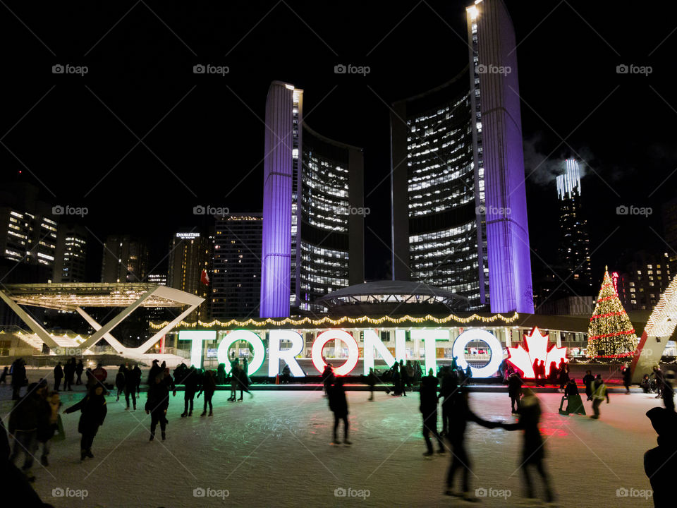 Toronto, Canada City Hall ice skating at night.
Night view of ice rink with crowd at Nathan Philips Square NPS.