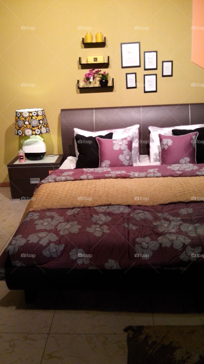 bed with pink and yellow. for a woman like me. 
feminine bed
