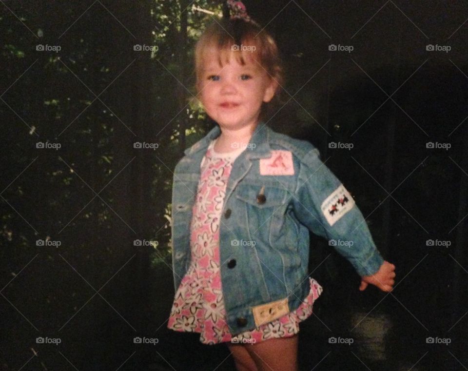 Toddler girl in a jean jacket