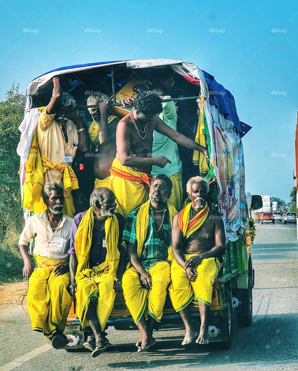 People on a pilgrimage in India. The yellow is an auspicious color. 