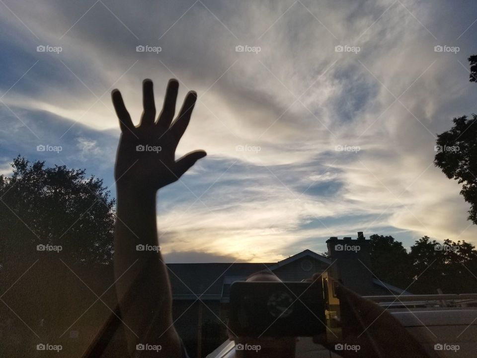Reflection shot off of a glass window can show us a different way of showing beauty in our site here you see me saying hi 👋 with the amazing beautiful sky behind me.