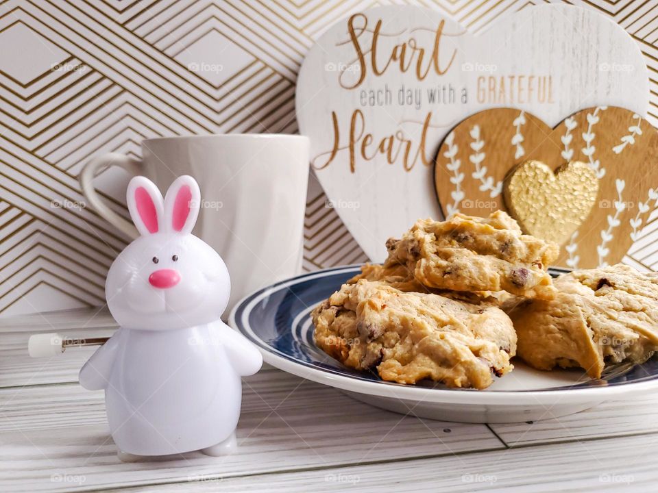 The Year of the Rabbit. A symbolic representation with a wind up Rabbit.   We often wind up and run non stop, but in the year of the Rabbit it is time to slow down, reflect, have hope and peace.  Maybe enjoy some cookies and tea.