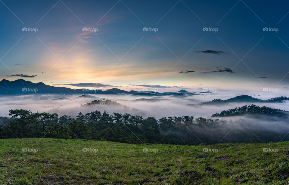 Fog over mountain during sunrise