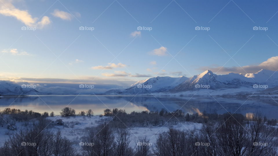View of mountain and lake during winter