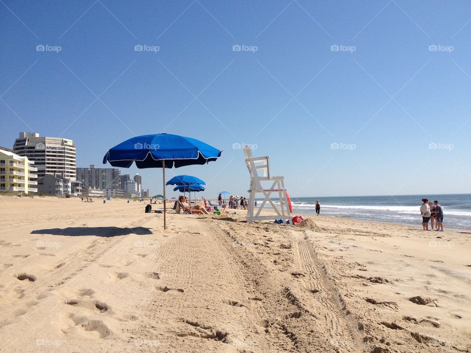 Umbrellas and lifeguard chair on the beach in Clearwater, Florida