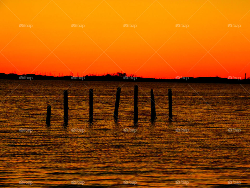 View of calm lake at sunset