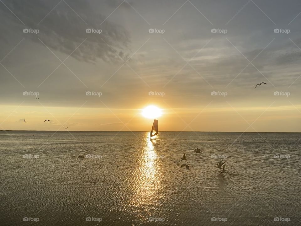 Beautiful sunset with sail