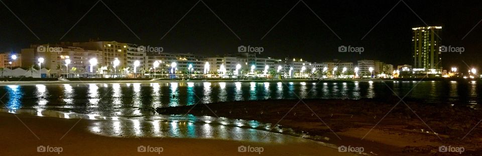 City lights the beach