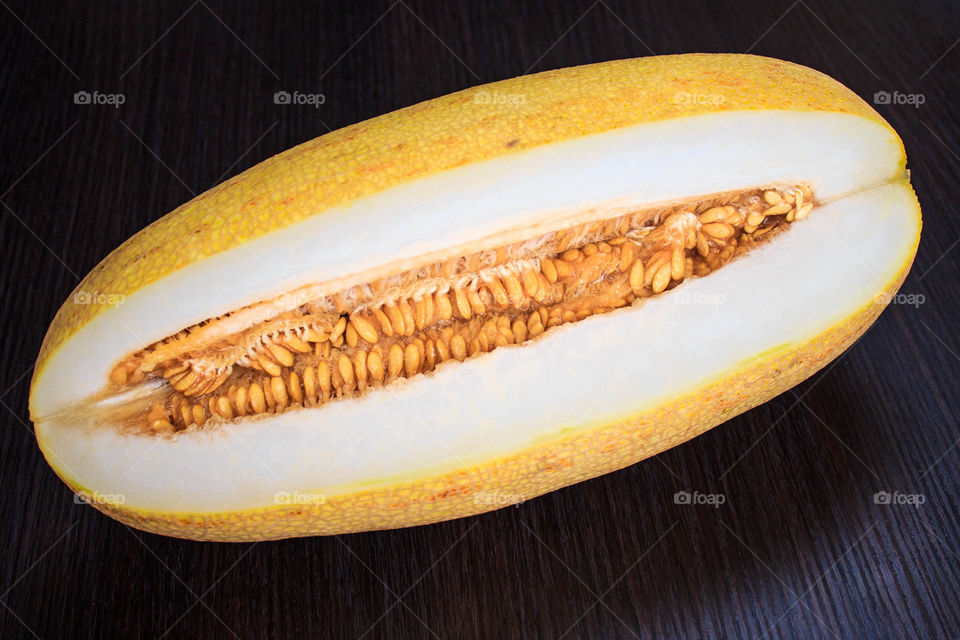 Close-up of appetizing melon on wooden table