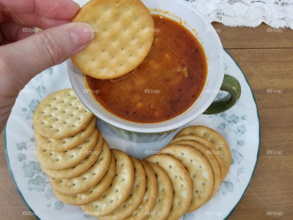 Dunking a Cracker in my Soup