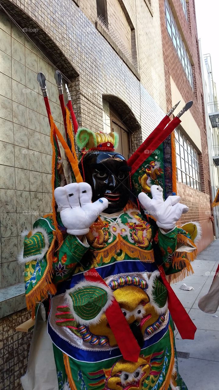 Masked dancer in Chinese costume
