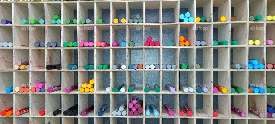 colored pencils on the shelves