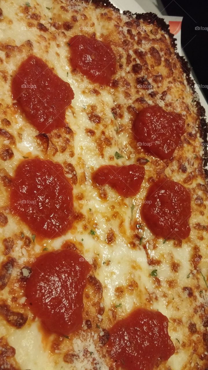 Having fun with tomato sauce and pizza
