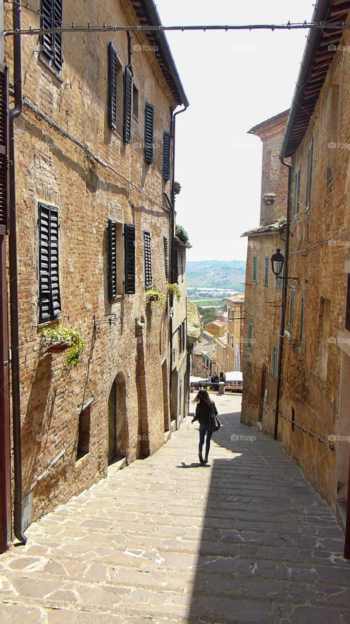 Walking in an old street. Walking in an old street between ancient houses