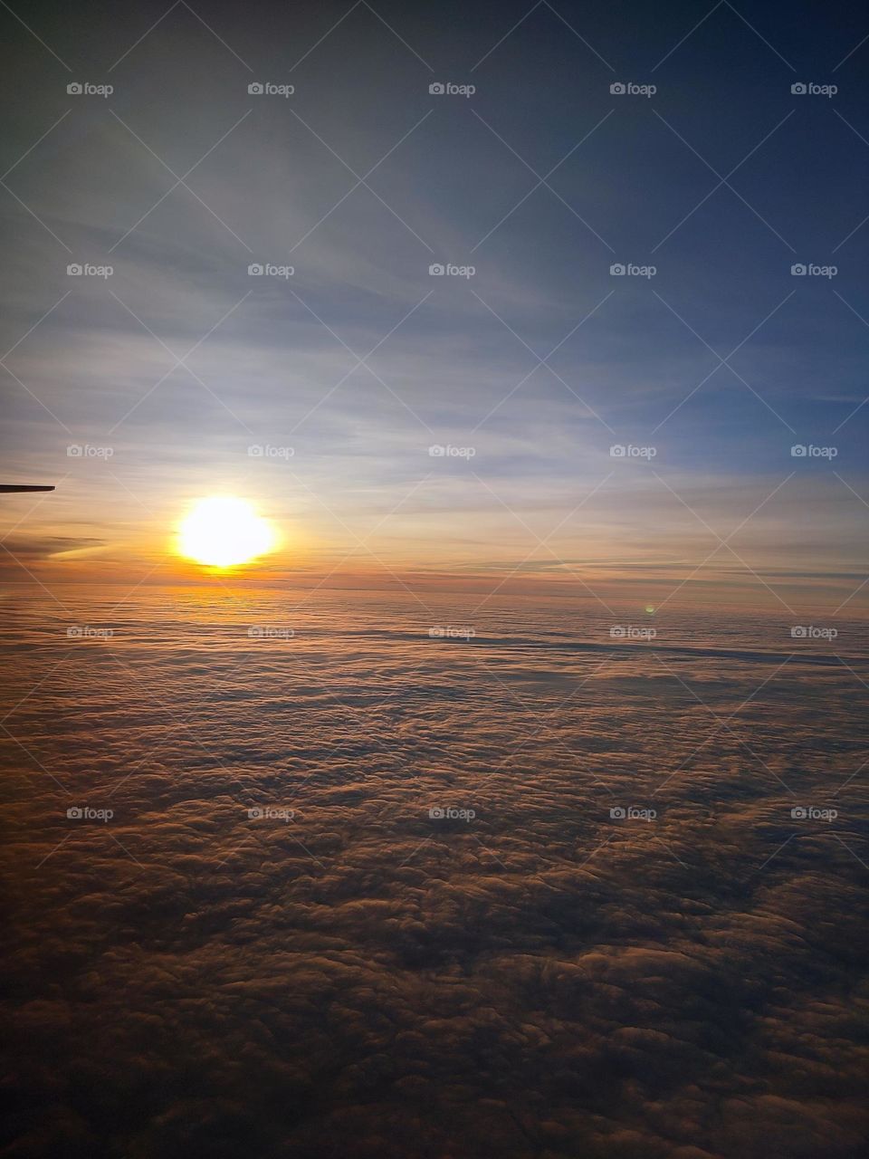 a photo taken from the airplane above the clouds on my trip to ukraine from india