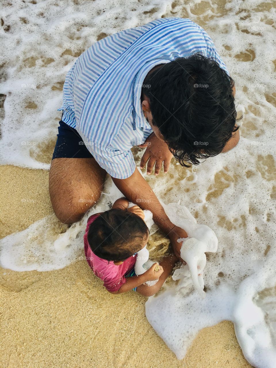 the father protected his son from waves