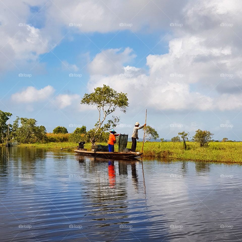 Scenic view of lake against blue sky