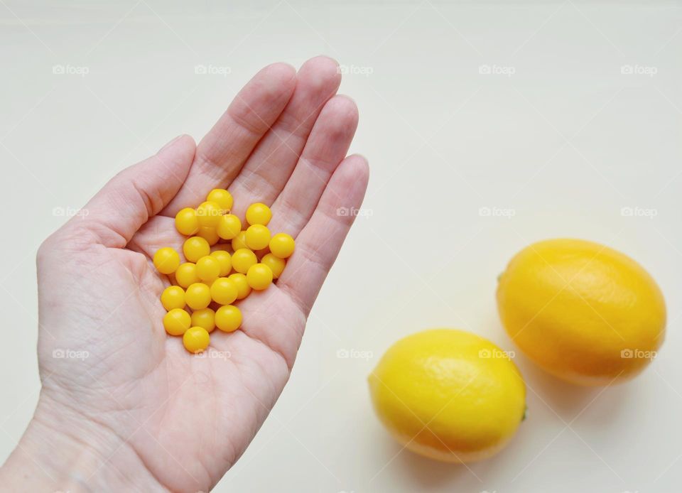 vitamins in the hand and lemon 🍋 healthy food