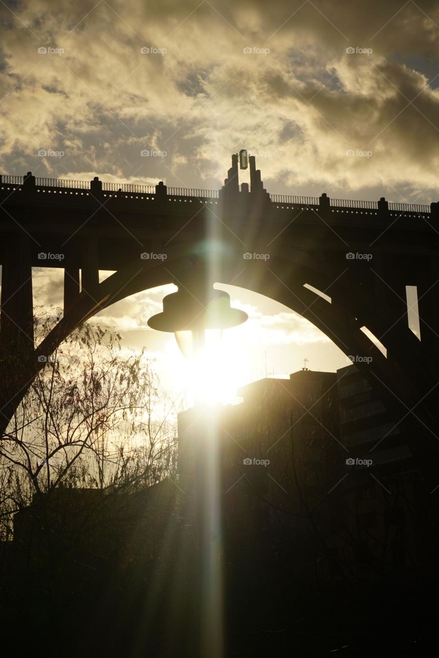 Bridge#sunset#lamp#sky#clouds#tree#rays